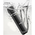 Black groomer with water splashes on a white background