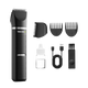 Black grooming kit with trimmer, attachments, and charging cable on a transparent background