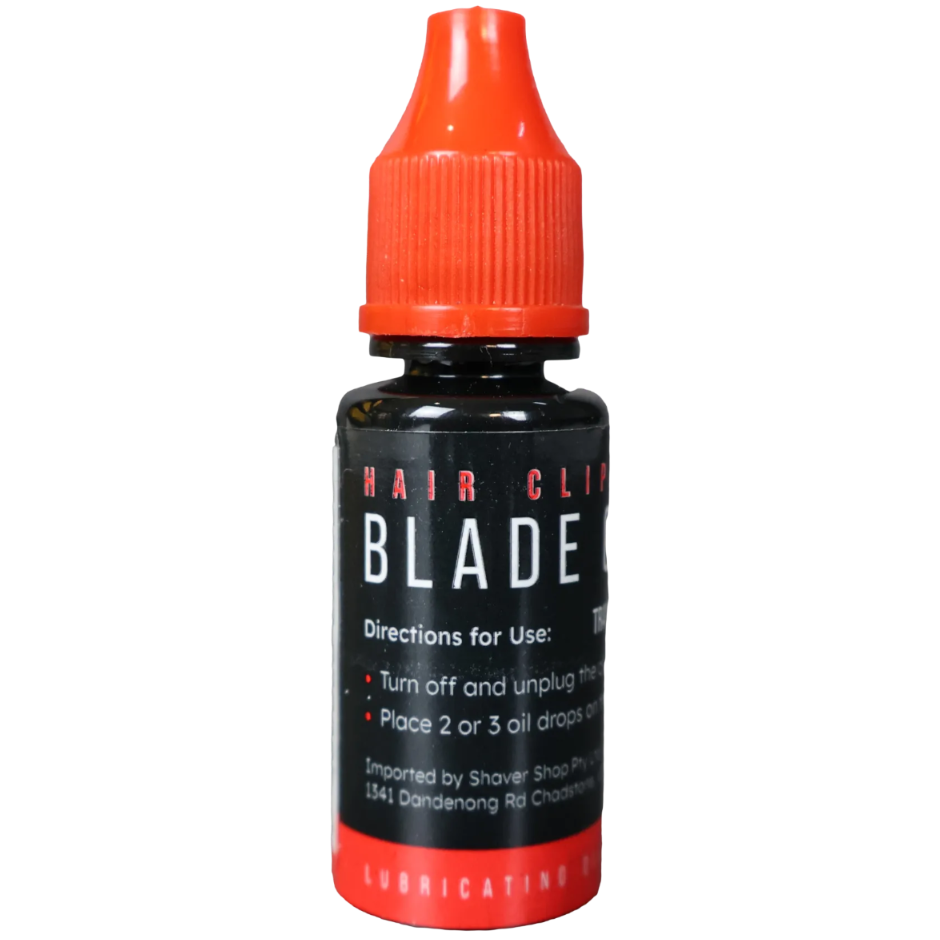 Bottle of blade oil with red cap and black label on a transparent background
