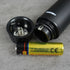 nose and ear trimmer AA battery on a gray surface