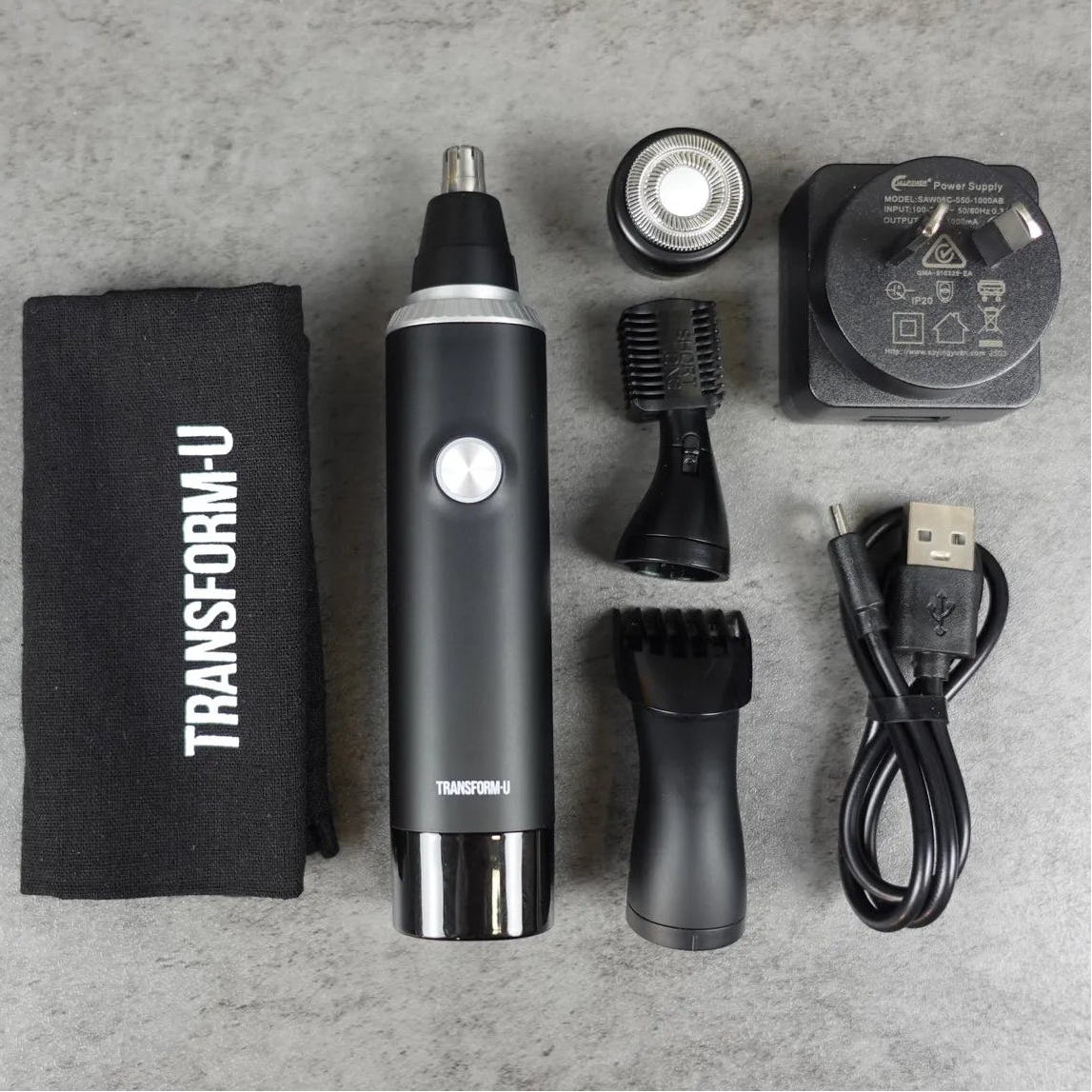 Nose and ear hair trimmer set with 'Transform-U' branding on a gray surface