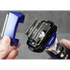 Close-up of a TRANSFORM-U shaver with a person holding it against a gray background