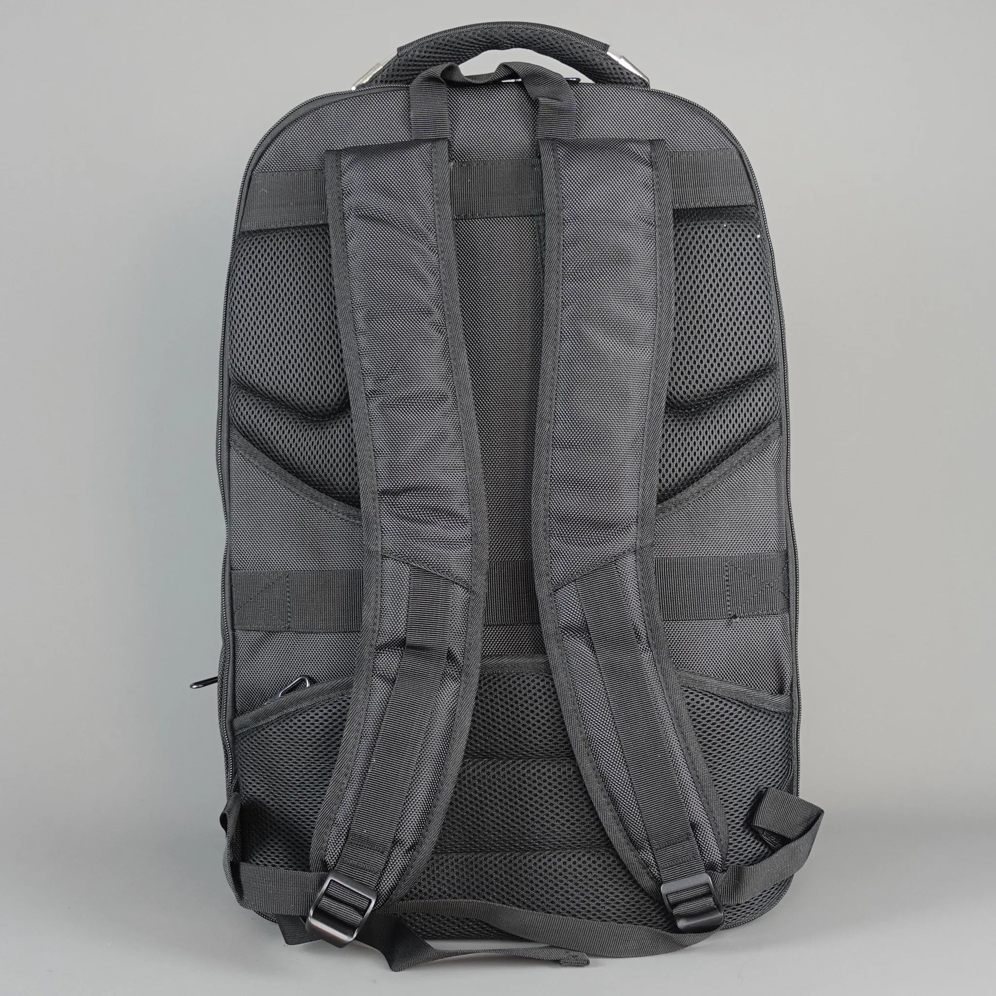 Dark backpack on a light gray background