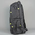 Black backpack with green accents on a gray background