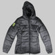 A dark gray hooded puffer jacket with horizontal quilting, a front zipper, and a bright neon yellow geometric logo patch on the left sleeve, shown against a solid black background.