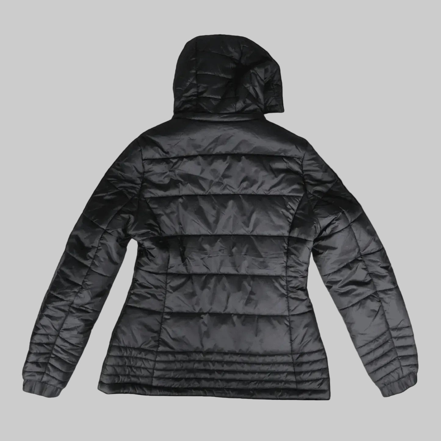 A black hooded puffer jacket shown from the back, featuring horizontal quilting and long sleeves, photographed against a solid black background.