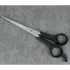 Pair of scissors on a gray concrete surface