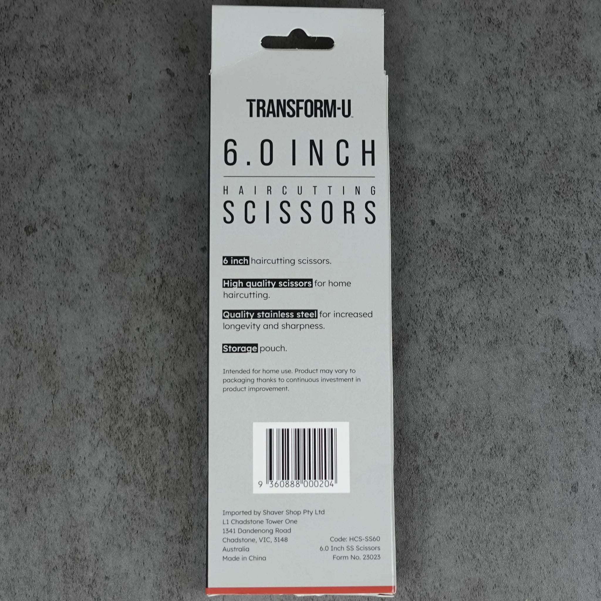 Packaging of Transform-U 6.0 inch haircutting scissors on a gray background