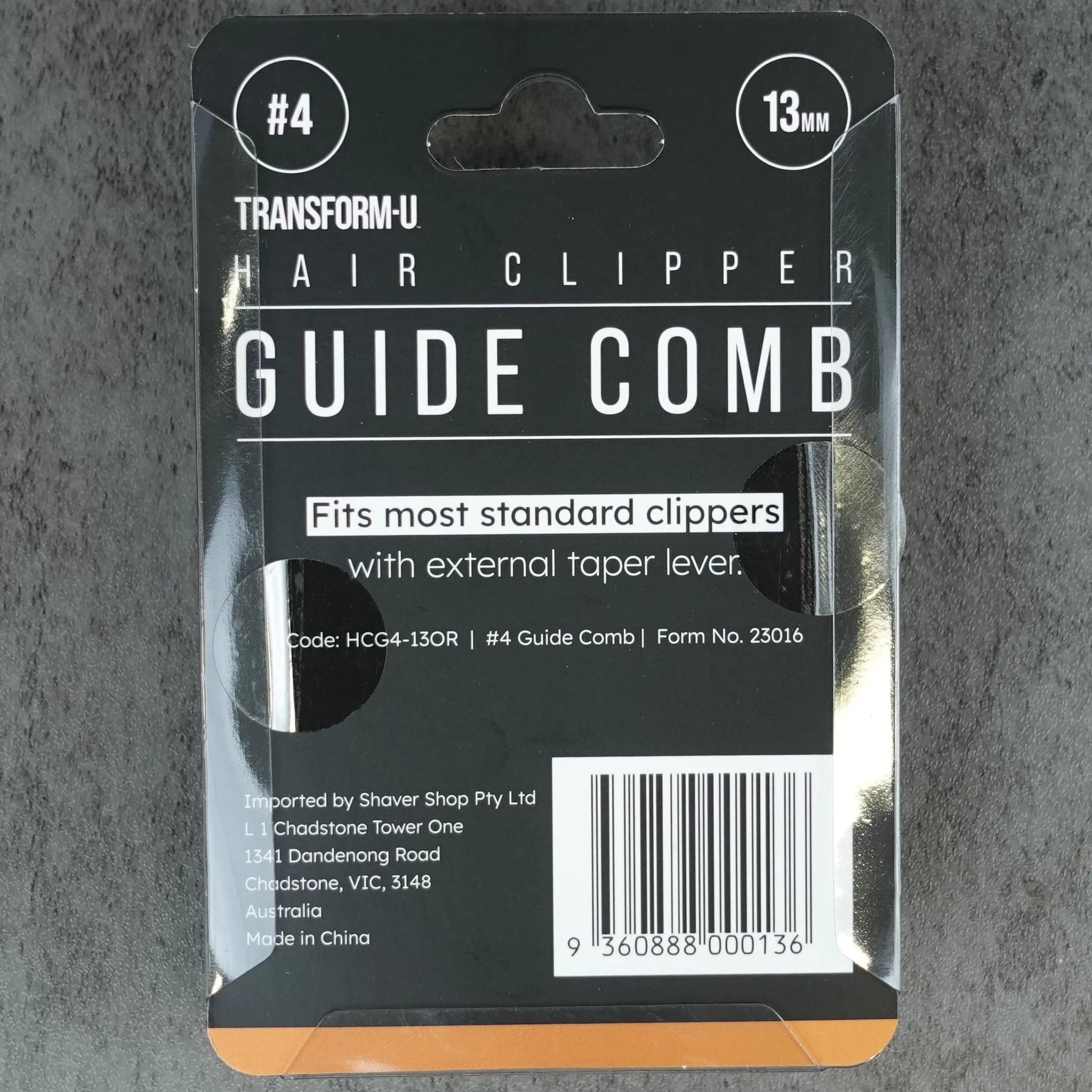 Package of a guide comb on a gray concrete surface