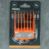 Orange guide comb in packaging on a gray concrete surface