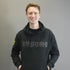 Man wearing a black hoodie with 'TRANSFORM-U' text on a gray background