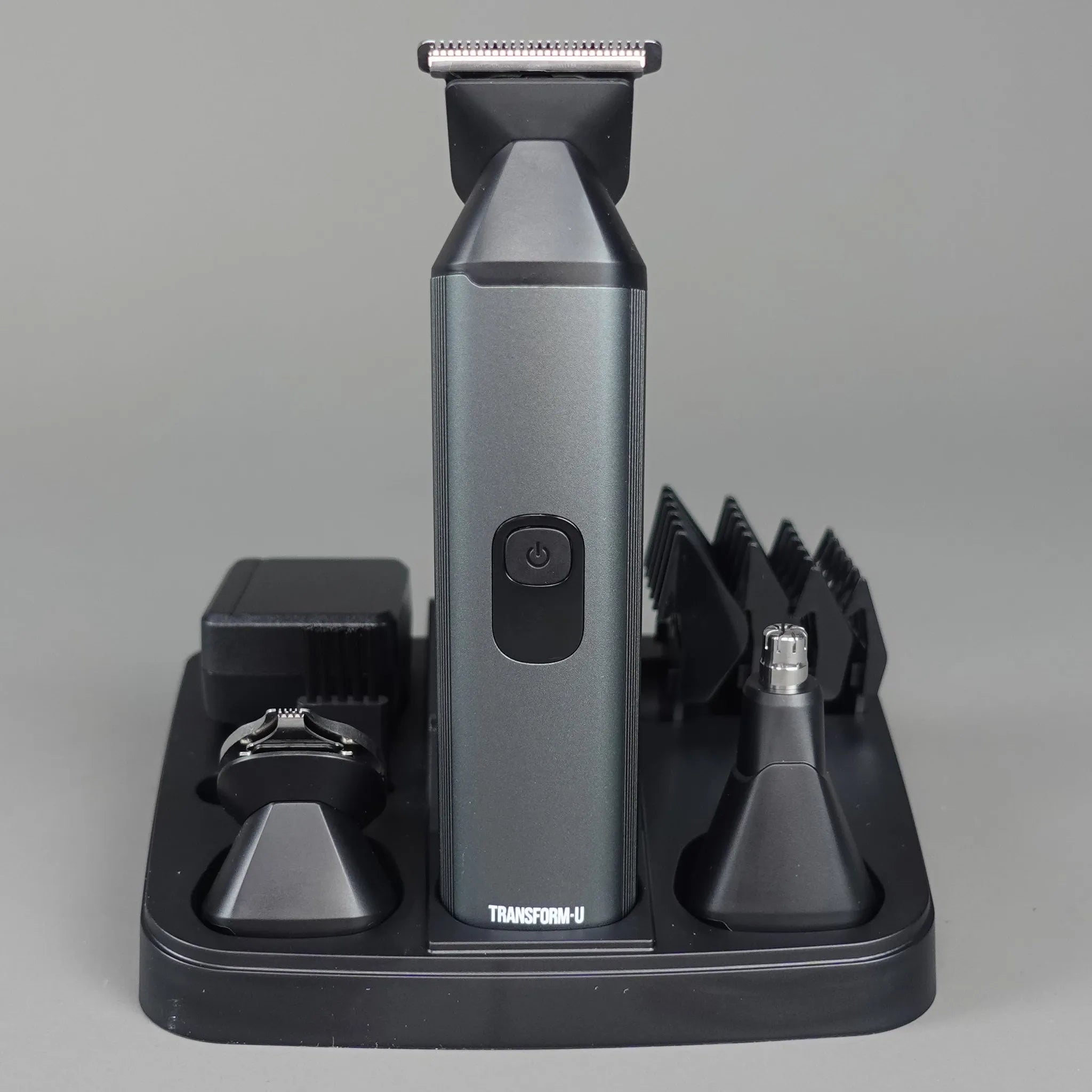 Hair trimmer with attachments on a gray background