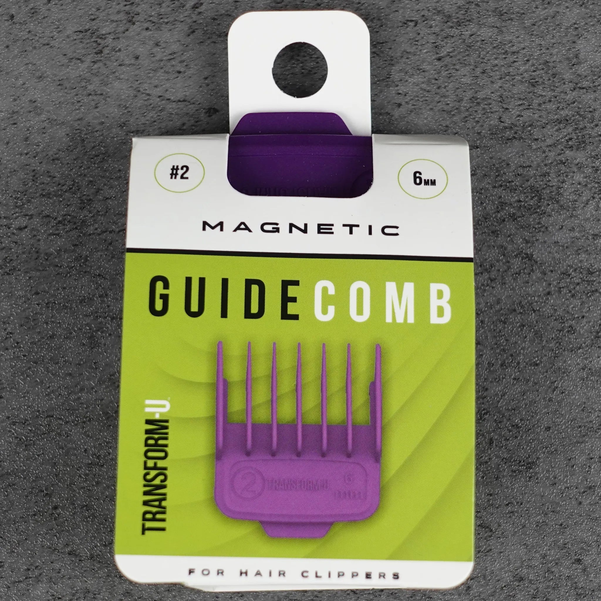 Purple magnetic guide comb on a gray textured background
