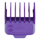 Purple hair clipper comb on a textured gray background