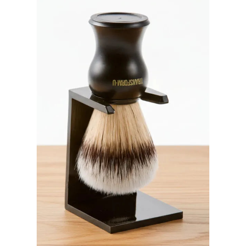 Shaving brush with black stand on a wooden surface