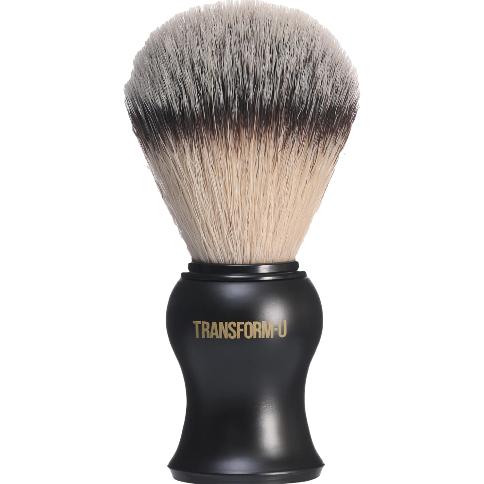 Black shaving brush with synthetic hair on a transparent background, branded 'Transform-U'.