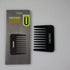 Black comb and its packaging on a gray background