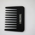 Black comb with 'Transform-U' branding on a white background