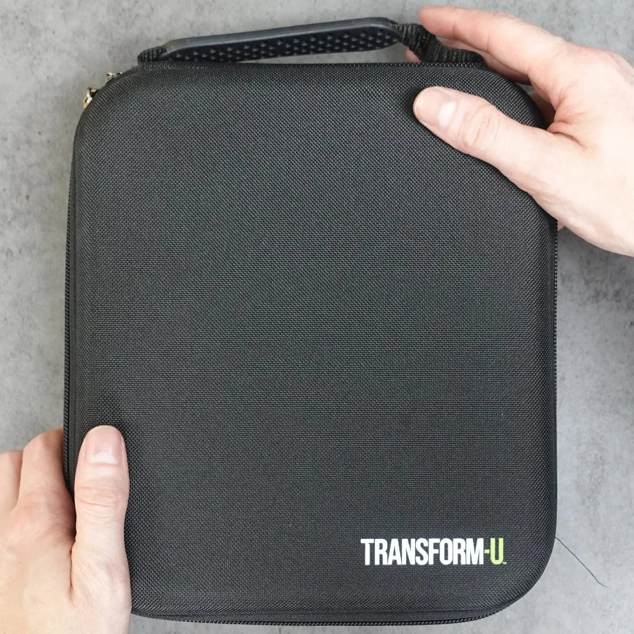 a black hair clipper case on a gray background