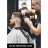 a man getting his hair clipped in a professional salon