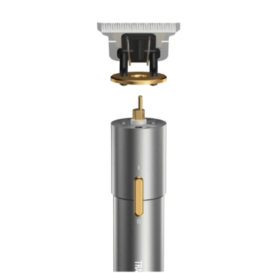 Hair trimmer head with gold accents on a white background