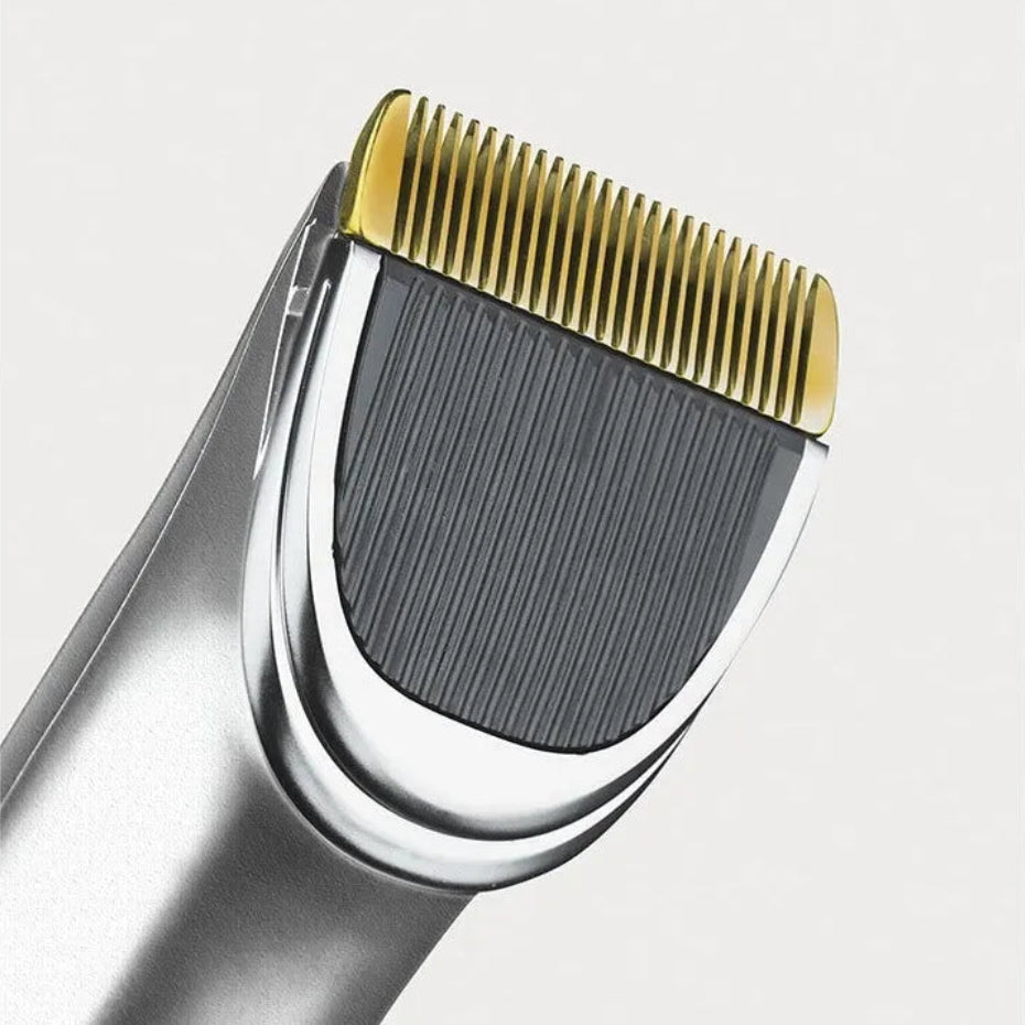 a golden hair clipper blade against a white background