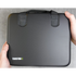 Black grooming case held by a person on a gray surface with 'Transform-U' branding.
