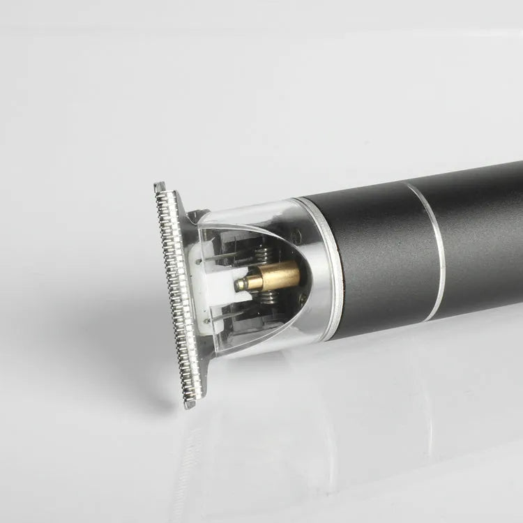 Close-up of a hair trimmer head on a gray background