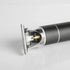 Close-up of a hair trimmer head on a gray background
