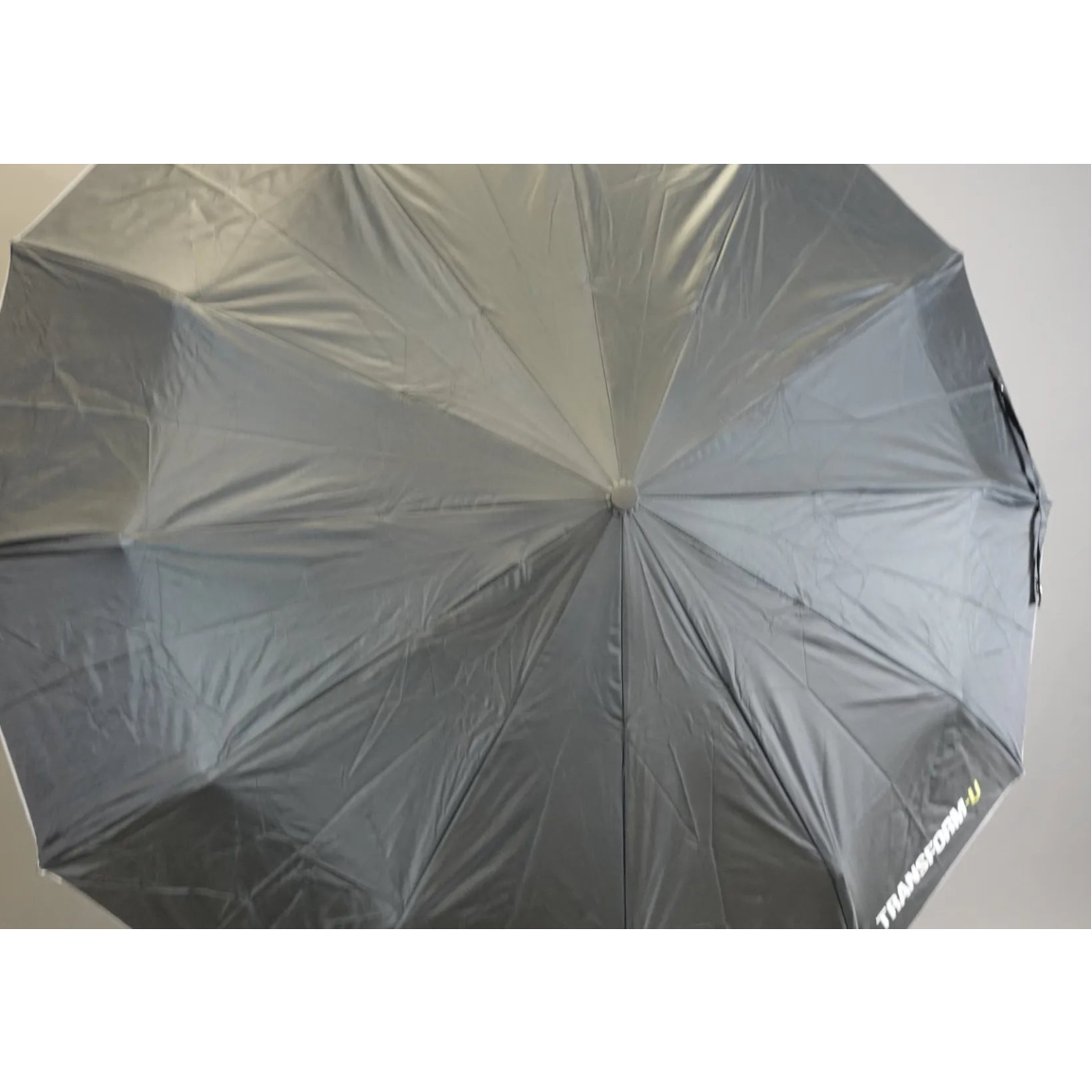 Gray umbrella with brand logo on a neutral background