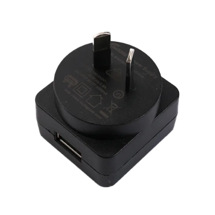 Black plug adapter with USB port on a transparent background